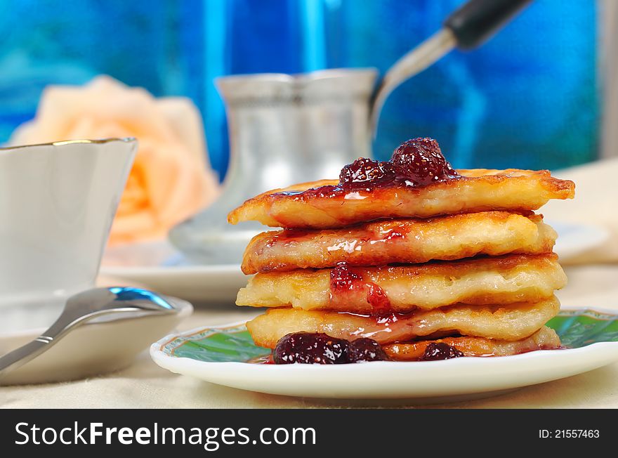 Sweet pancakes with strawberry jam