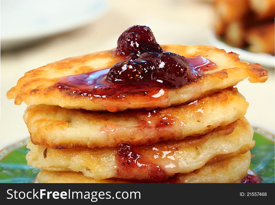 Sweet pancakes with strawberry jam