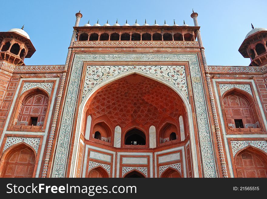 The beautiful gate to Taj Mahal in Agra in the Uttar Pradesh region of India. It is a one of New Seven Wonders of the World. The beautiful gate to Taj Mahal in Agra in the Uttar Pradesh region of India. It is a one of New Seven Wonders of the World.