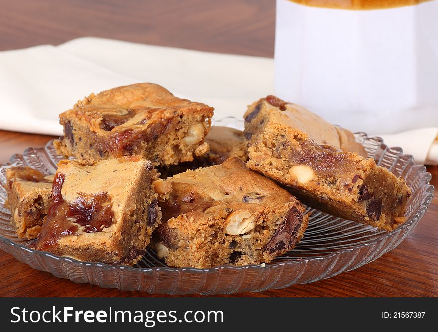 Glass plate of nutty peanut butter squares