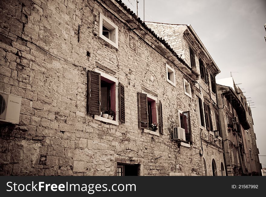 Dark image of an old stone house in Croatian town