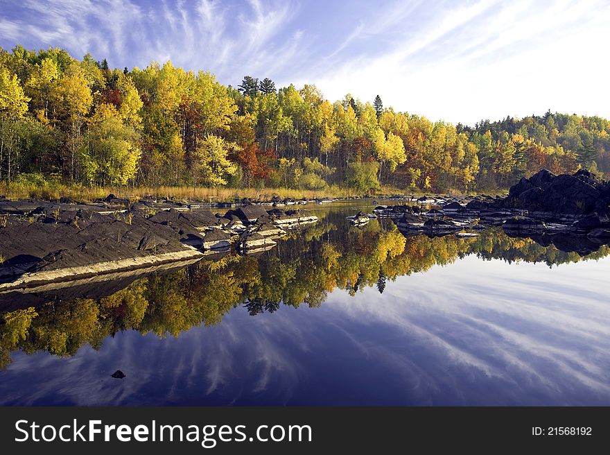 Fall colors reflecting in a calm stretch of water, Jay Cooke S P, Minnesota. Fall colors reflecting in a calm stretch of water, Jay Cooke S P, Minnesota