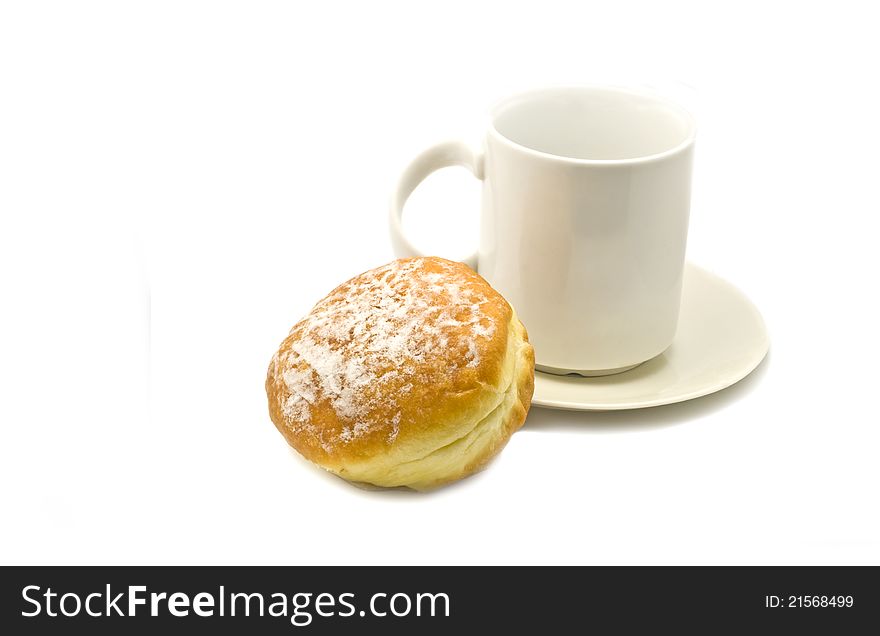 A cup of tea and a chocolate donut with sugar isolated on white