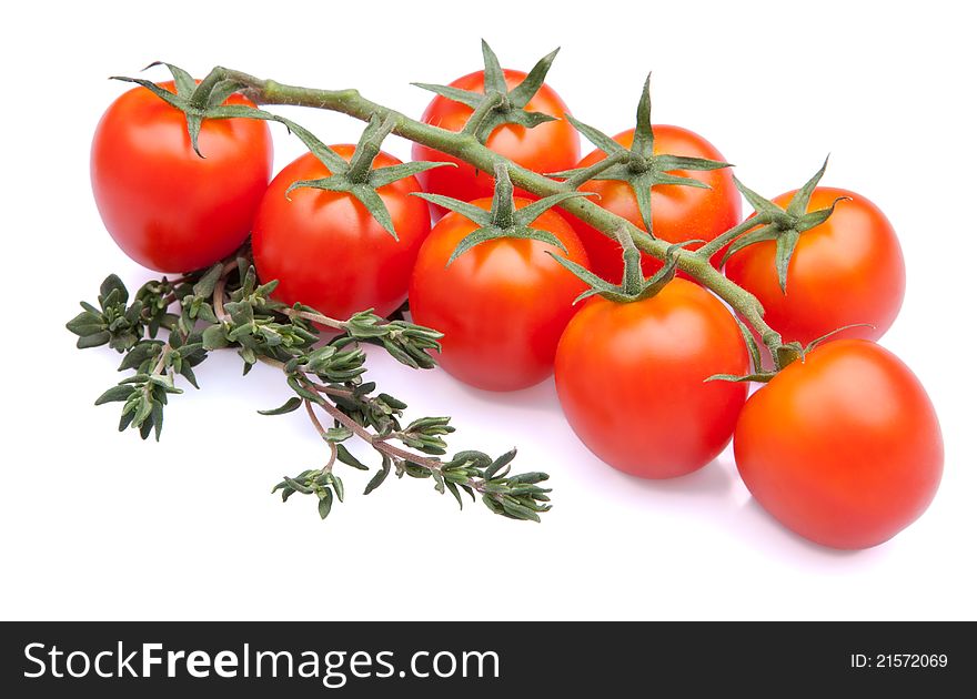 Cherry tomatoes with thyme on white background