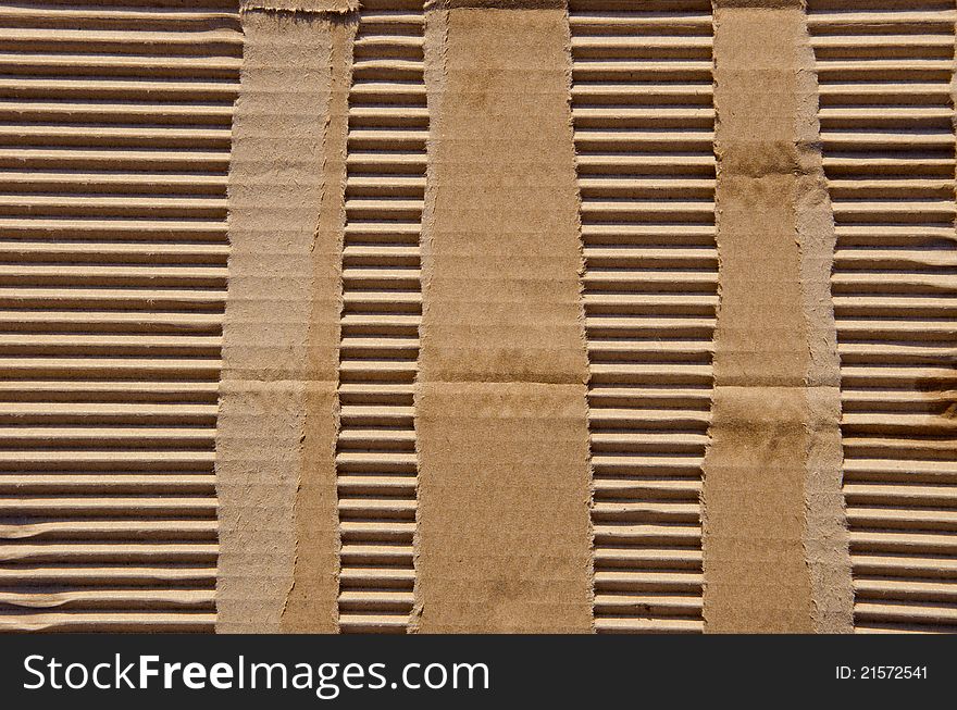 Paper box background. Fragment of packing box wall. Backdrop. Wallpaper. Paper box background. Fragment of packing box wall. Backdrop. Wallpaper.