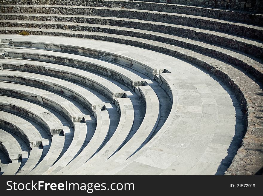 Old curved stairs of ancient greek amphitheater. Old curved stairs of ancient greek amphitheater