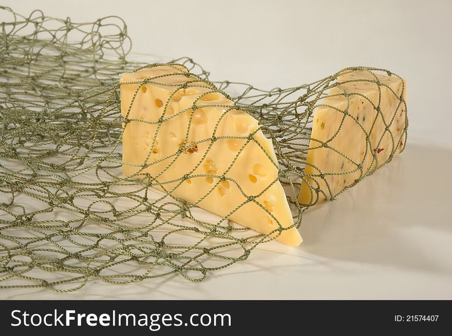 Hard cheese in a net