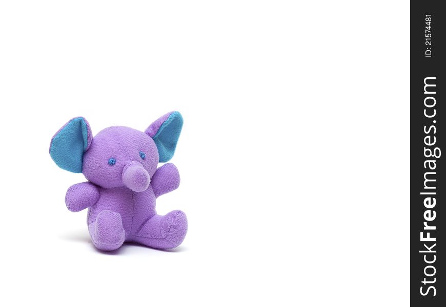 Purple toy elephant on a white background