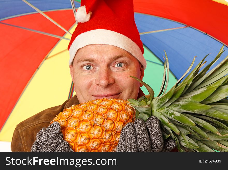 Man in the New Year's Eve wants to get a taste of summer sun and pineapple. Man in the New Year's Eve wants to get a taste of summer sun and pineapple