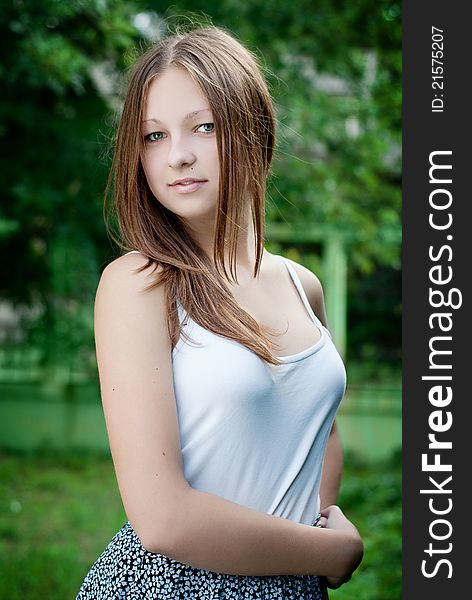 Young Model Portrait On Green Background.