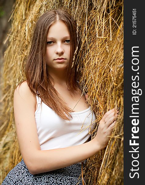Young Womans Portrait With Hay Background.