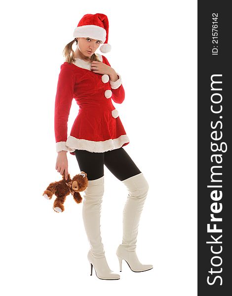 Santa's helper in tall white boots holding a toy. Santa's helper in tall white boots holding a toy