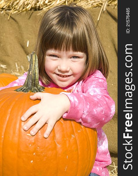 Little Girl with Pumpkins