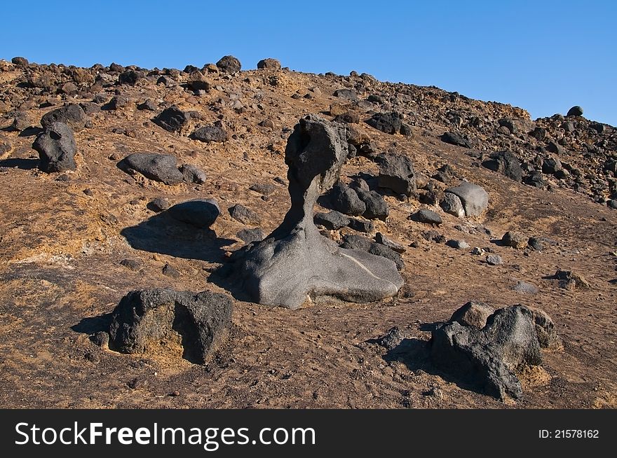 Death valley national park with stone sculpture and rocky lunar landscape. Death valley national park with stone sculpture and rocky lunar landscape