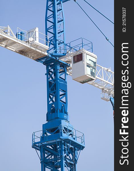 Crane on a blue sky background. Crane on a blue sky background