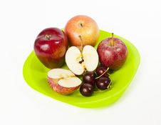 Red Big Apple And Cherry On Green Plate Isolated O Royalty Free Stock Image Red Big Apple And Cherry On Green Plate Isolated O Royalty Free Stock Image