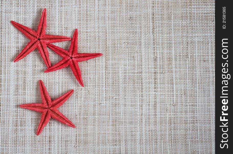 Starfish on hessian for beach concept with space for text