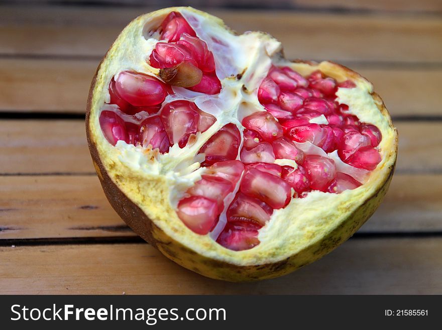 A picture of pomegranate splited in half fruit