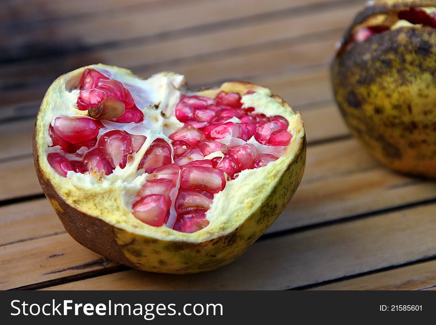 A picture of pomegranate splited in half fruit