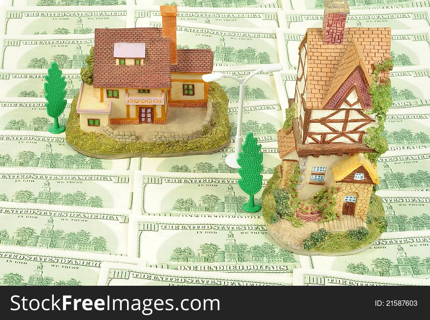 Houses on American Dollars background, close up shot. Houses on American Dollars background, close up shot