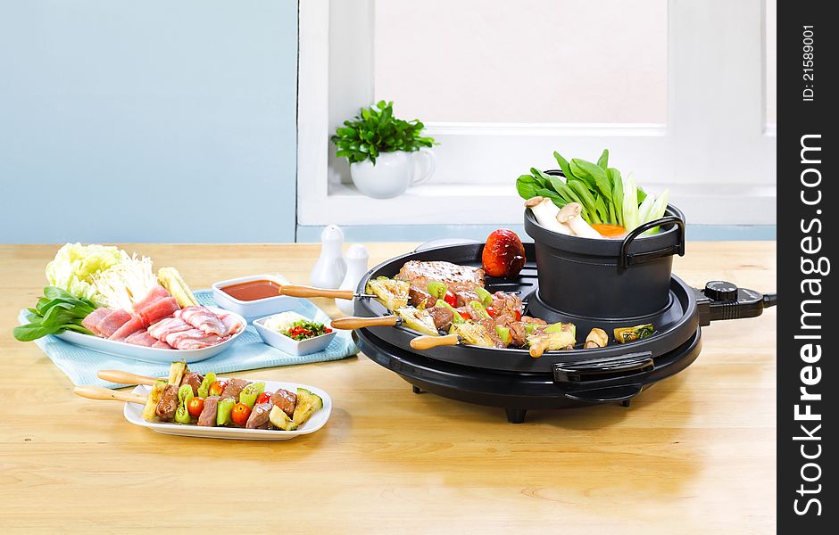 Let's enjoy cooking with barbecue smokeless stove and boiling pot could makes sukiyaki japanese food. Let's enjoy cooking with barbecue smokeless stove and boiling pot could makes sukiyaki japanese food