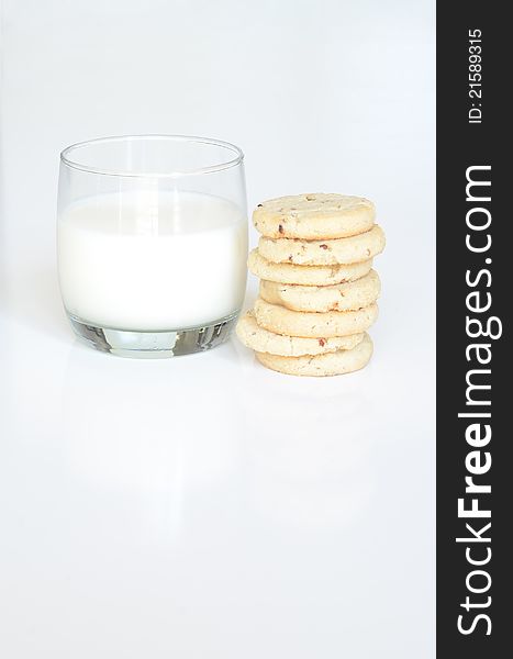 Small glass of milk with a stack of cookies. Small glass of milk with a stack of cookies