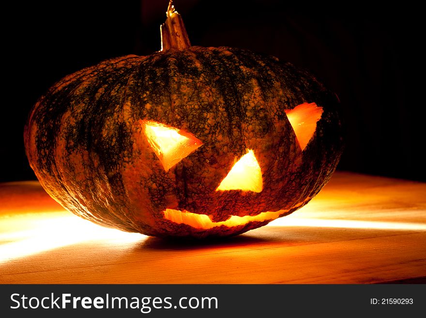 Halloween pumpkin on black background.