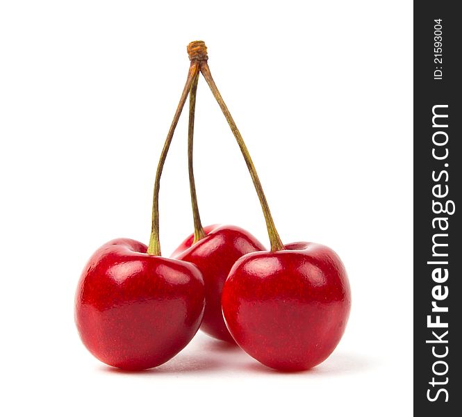 Ripe red cherries on a white background. Ripe red cherries on a white background