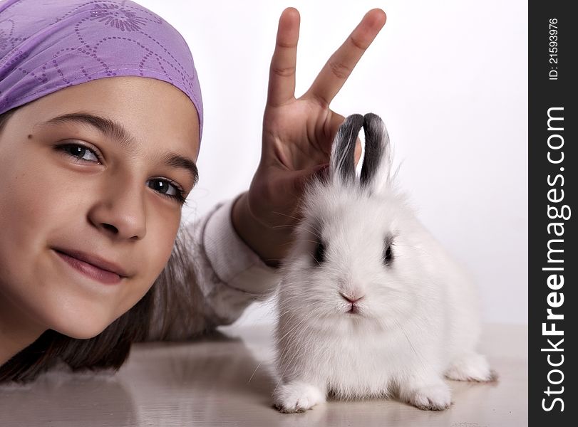 Little white rabbit and a girl posing, clipping path included