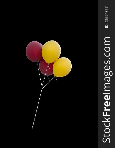 Gold and burgundy baloons, isolated on black background, easy to select. Gold and burgundy baloons, isolated on black background, easy to select