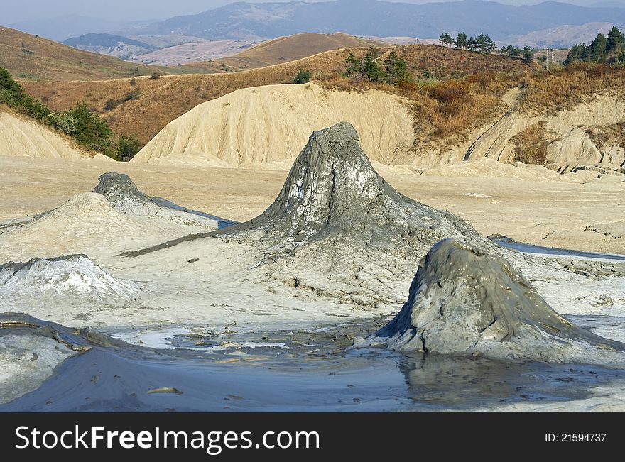 Muddy volcanic cones and autumn landscape, raw. Muddy volcanic cones and autumn landscape, raw