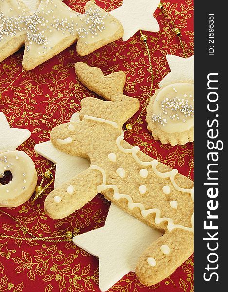 Fresh home-made Christmas cookies of different shapes decorated for holiday.