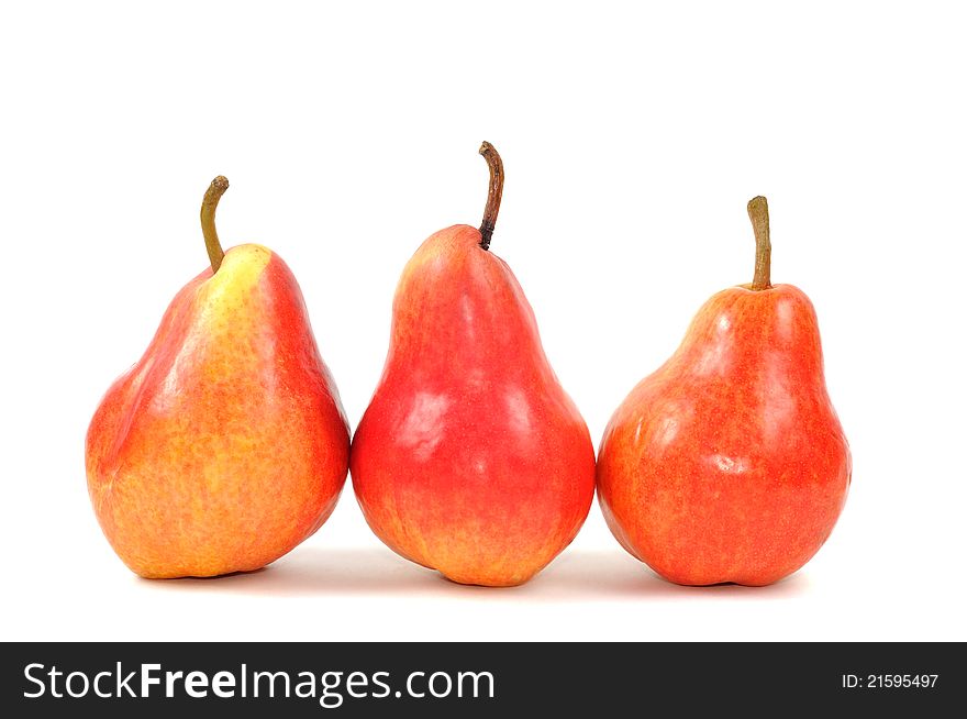 Fresh red pears on a white background, close up. Fresh red pears on a white background, close up