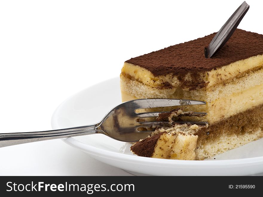 Tiramisu Cake On The Plate Over White Background