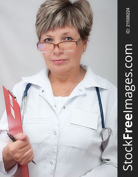 Mature woman doctor holding a file