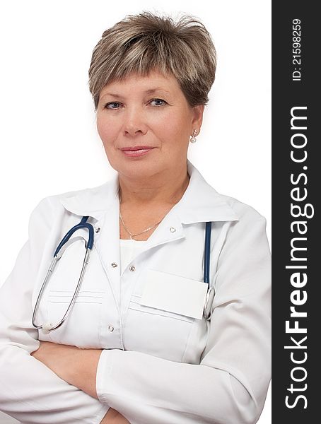 Mature woman doctor standing with hands crossed
