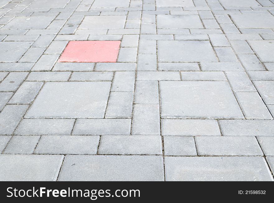 Abstract design of a cobblestone sidewalk.