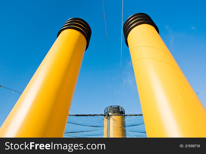 Three yellow funnels of cruise liner