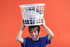 Boy Holding Laundry Stock Photo Boy Holding Laundry Stock Photo
