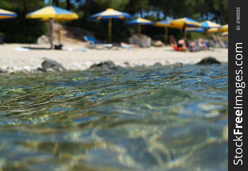 This picture shows a beach on a summer day. Picture is artisticly blury!. This picture shows a beach on a summer day. Picture is artisticly blury!