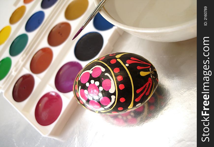 Colored easter egg and paint