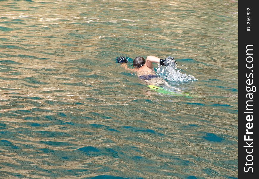 Boy swimming in the sea.