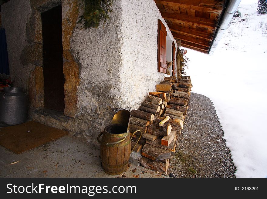 Old rustic farm in the alps in a place called beaufortain with wood for the chimney