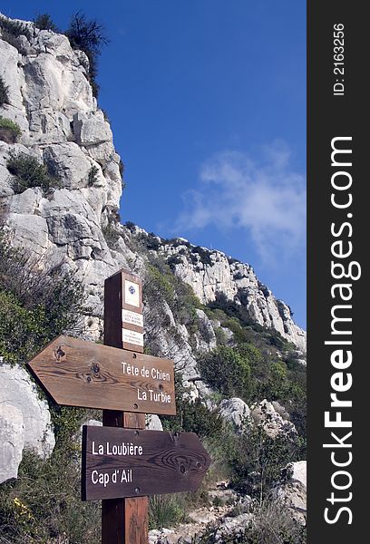 Wooden direction indication panels on a mountain path in the south of France