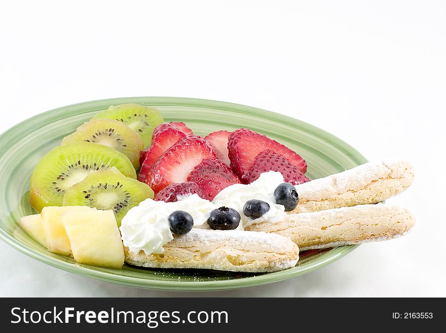 Strawberries,kiwi,pineapple,blue berries,whipped and lady fingers combine to make this an appealing dessert. Strawberries,kiwi,pineapple,blue berries,whipped and lady fingers combine to make this an appealing dessert.