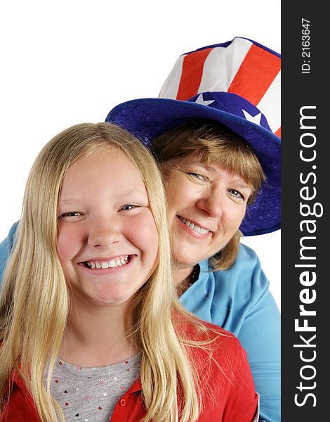 A cute american girl and her mother dressed for the Fourth of July holiday. Isolated on white. A cute american girl and her mother dressed for the Fourth of July holiday. Isolated on white.