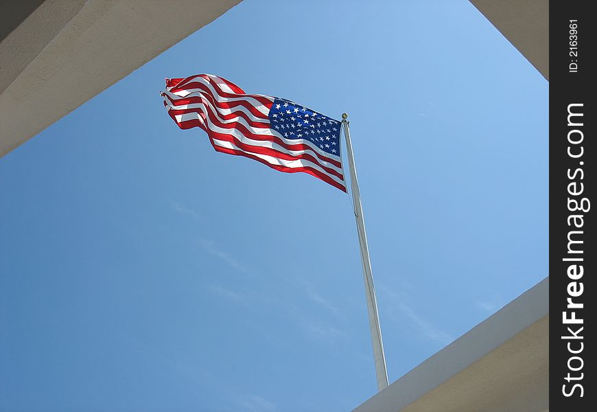 A picture of the American flag that flies over the USS. Arizona memorial. A picture of the American flag that flies over the USS. Arizona memorial
