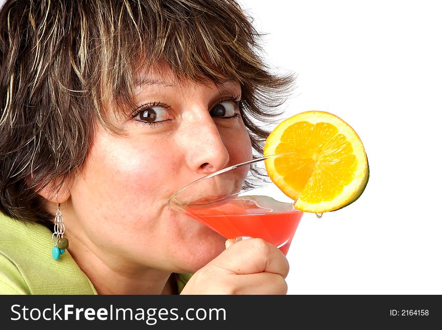 Woman drinking a colorful tropical drink.