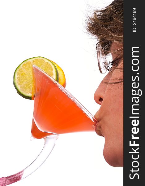 Woman drinking a colorful tropical drink.