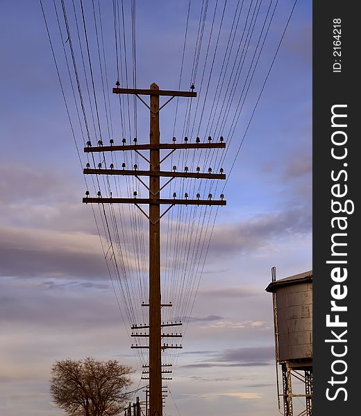 Telegraph wires and poles at sunset. Telegraph wires and poles at sunset